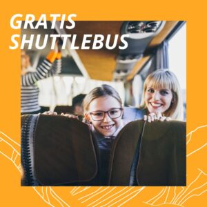 Ouder en kind in de pendelbus van Vaujany