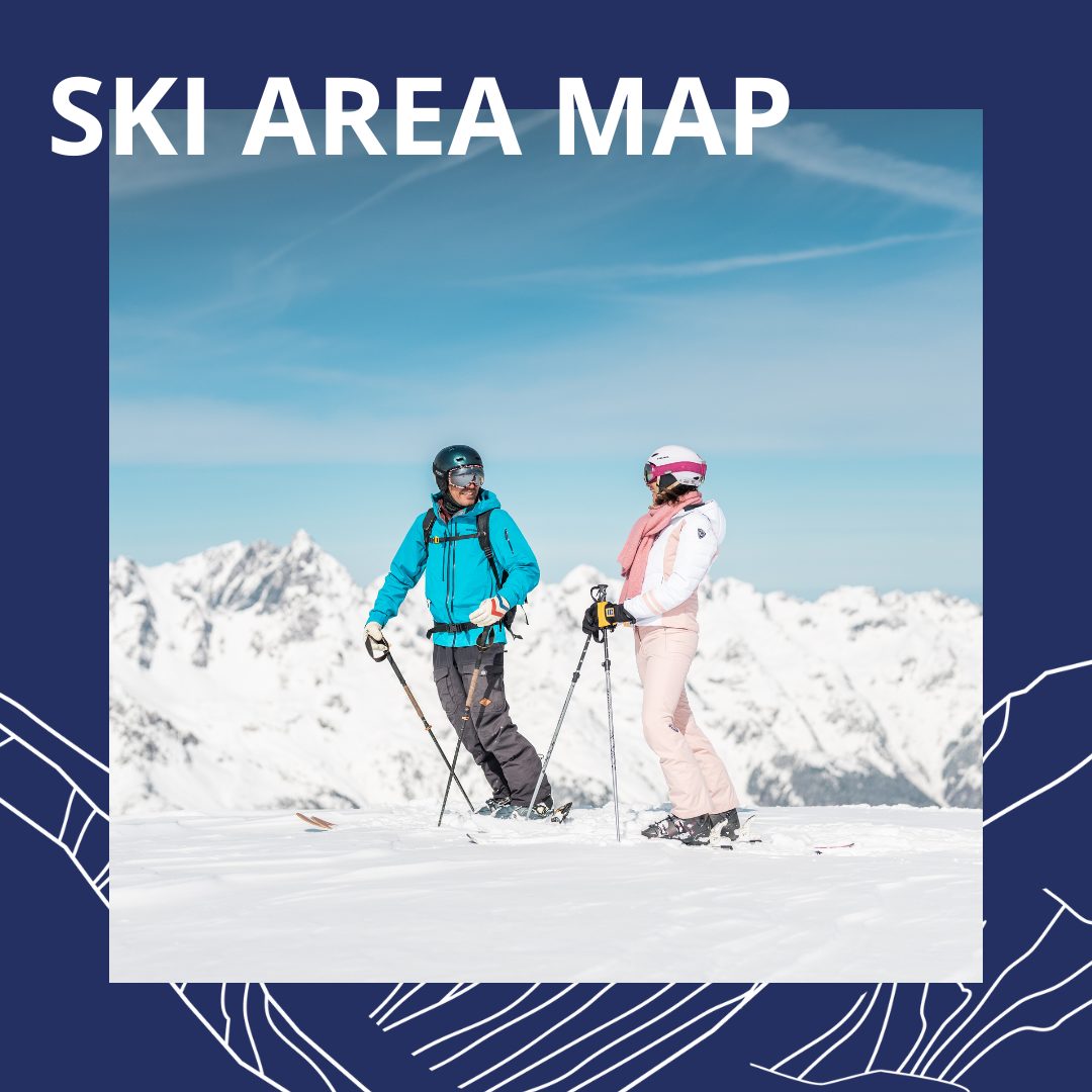 Couple of skiers standing on the top of the mountain and enjoing the panoramical view with snowy summits